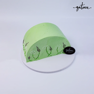 Green cake decorated with dandelion-lavender-flower design from Gateau Gourmet Cafe