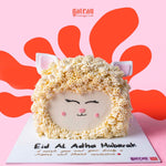 Eid Al Adha cake designed as a sheep with cute facial features for festive celebrations