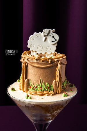 Eid Al Adha cakes by Gateau Gourmet Cafe with chocolate frosting and a decorative white sheep topper