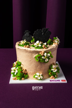 Gateau Gourmet Cafe Eid Al Adha cakes with decorative sheep and floral green frosting on cream cake