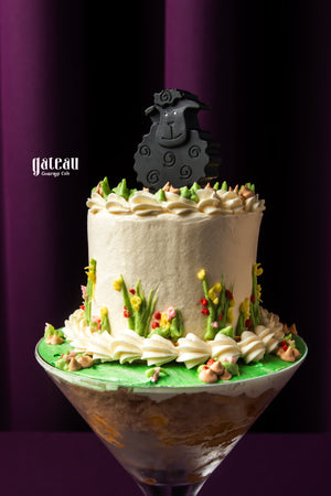 Eid Al Adha cakes by Gateau Gourmet Cafe featuring a decorated cake with a black sheep topper and floral icing