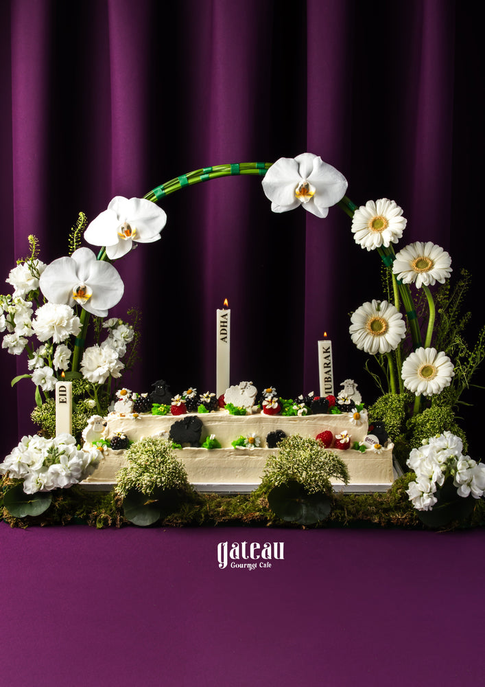 Eid special floral cake from Gateau Gourmet Cafe decorated with white orchids and daisies on a purple background