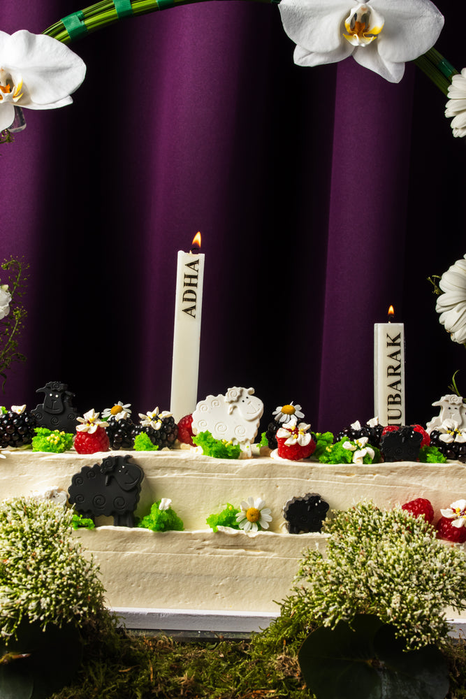 Eid special floral cake from Gateau Gourmet Cafe decorated with flowers, candles, and festive details