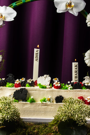 Eid special floral cake from Gateau Gourmet Cafe decorated with flowers, candles, and festive details