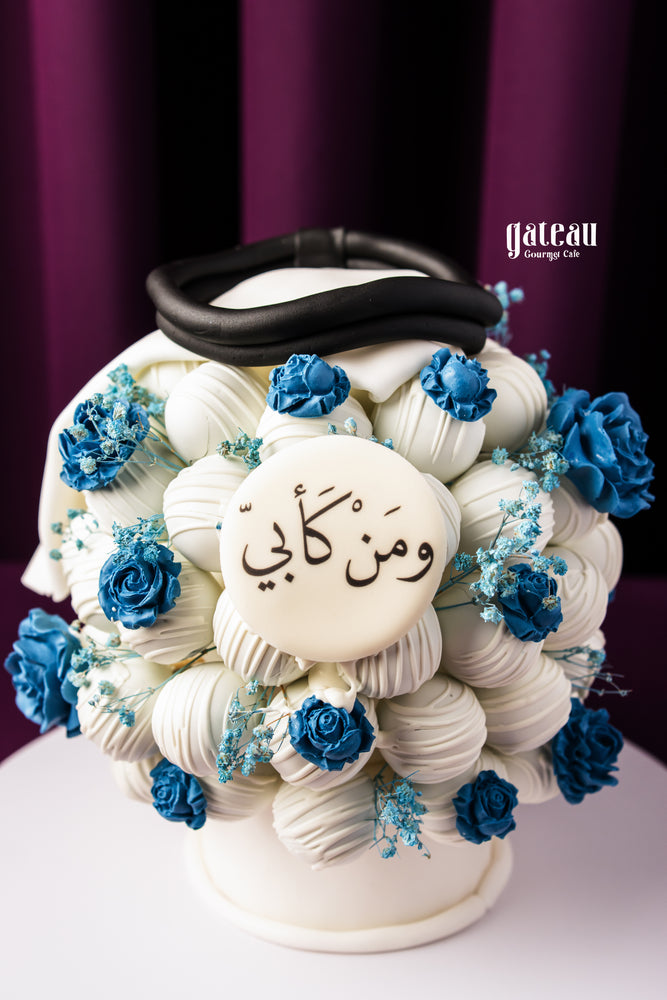 Father's Day cake bouquet by Gateau Gourmet Cafe with white and blue decorated cake pops in a bouquet style