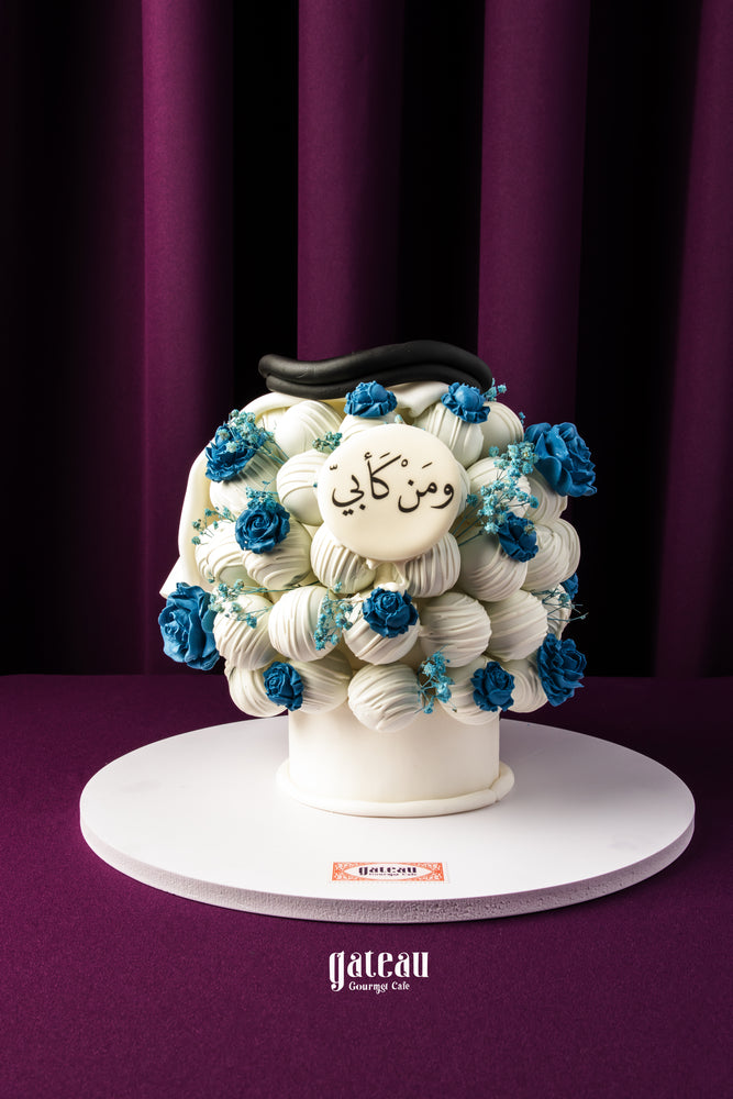 Father's Day cake bouquet from Gateau Gourmet Cafe with white cream and blue flower decorations