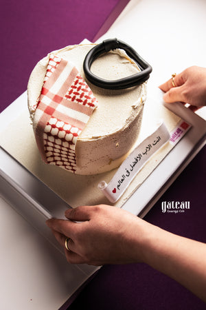 Father's Day cake from Gateau Gourmet Cafe with traditional patterned decoration and black accessory on top