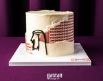 Father's Day cake by Gateau Gourmet Cafe with white frosting and artistic red and black design