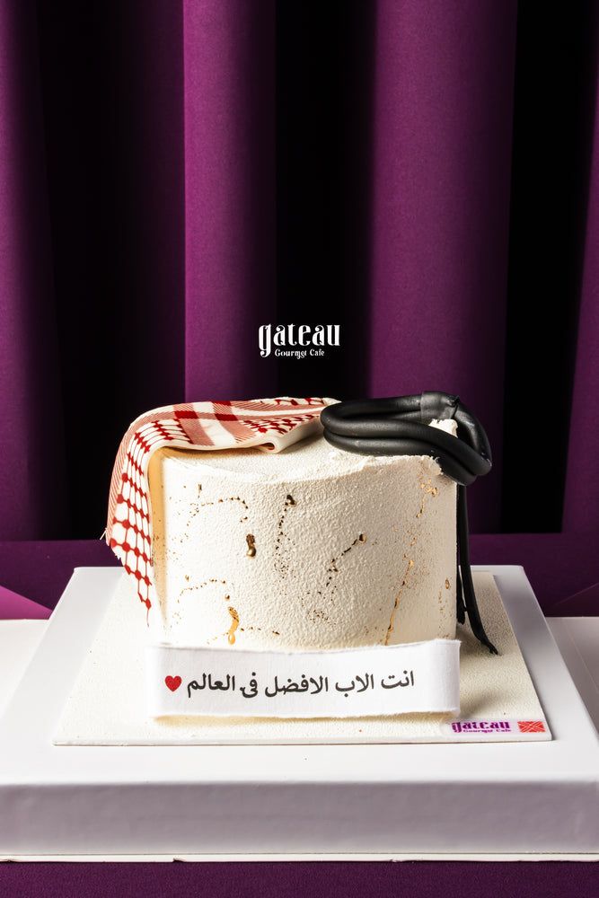 Gateau Gourmet Cafe Father's Day cake with white frosting and fondant accessories on white base
