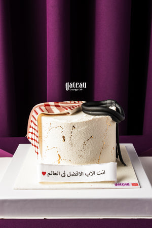Gateau Gourmet Cafe Father's Day cake with white frosting and fondant accessories on white base