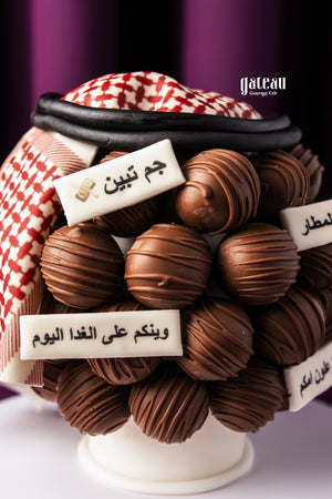 Father's Day chocolate truffles decorated with Arabic calligraphy and traditional red and white keffiyeh by Gateau Gourmet Cafe