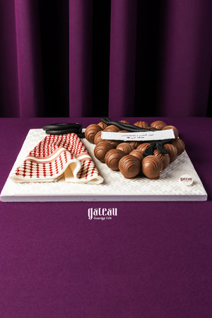 Father's Day chocolate truffles cake from Gateau Gourmet Cafe with elegant chocolate decoration on white board