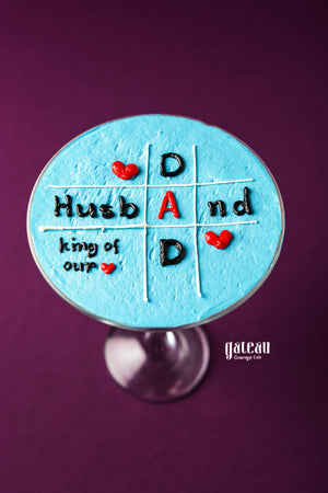 Father's Day goblet cake from Gateau Gourmet Cafe with blue icing and tic tac toe design