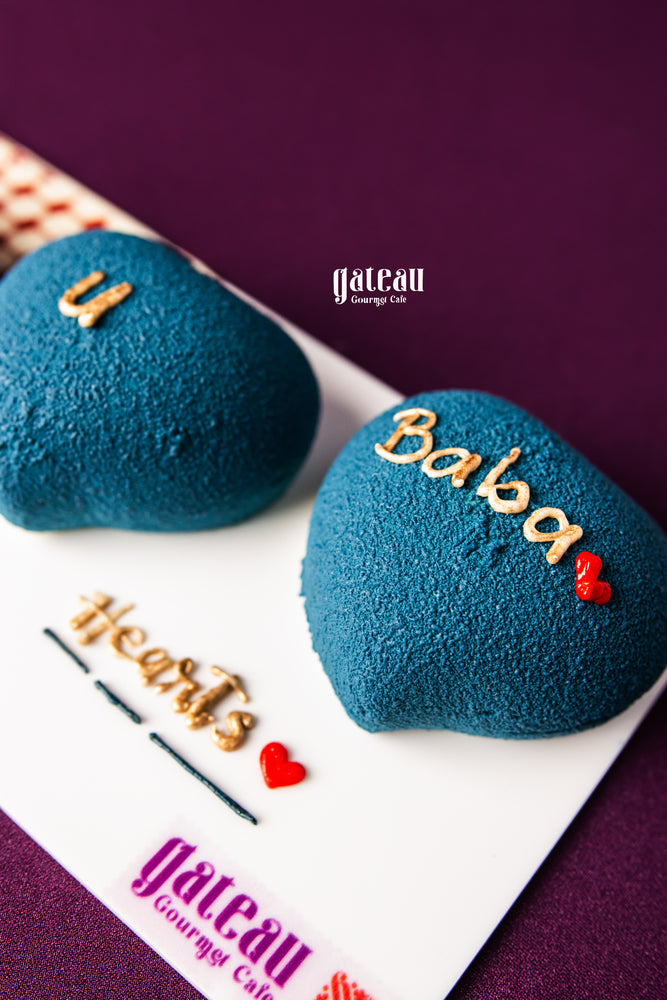 Heart-shaped blue cakes from Gateau Gourmet Cafe featuring Father's Day gourmet treats with decorative text and red hearts