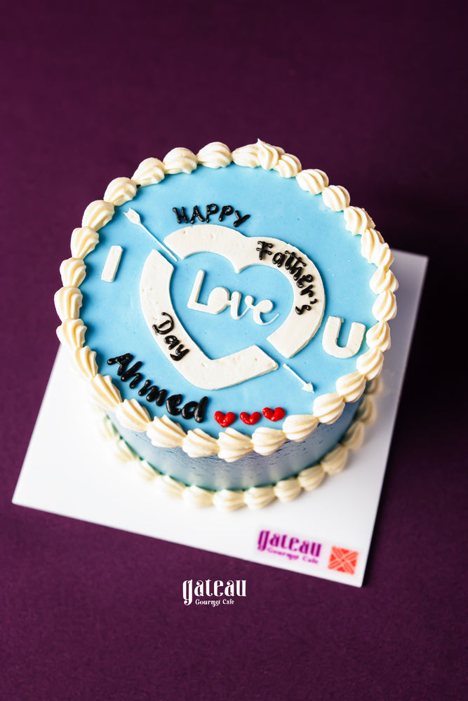 Father's Day mini cake by Gateau Gourmet Cafe with blue frosting and personalized message on top