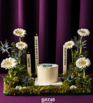 Father's Day mini cake from Gateau Gourmet Cafe surrounded by white daisies and decorative candles