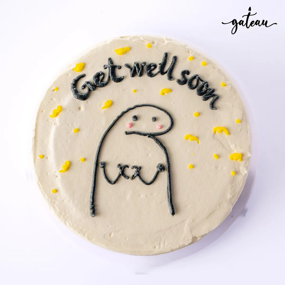 Gateau Gourmet Cafe get well soon cake with cute Flork cake design and yellow accents on white frosting