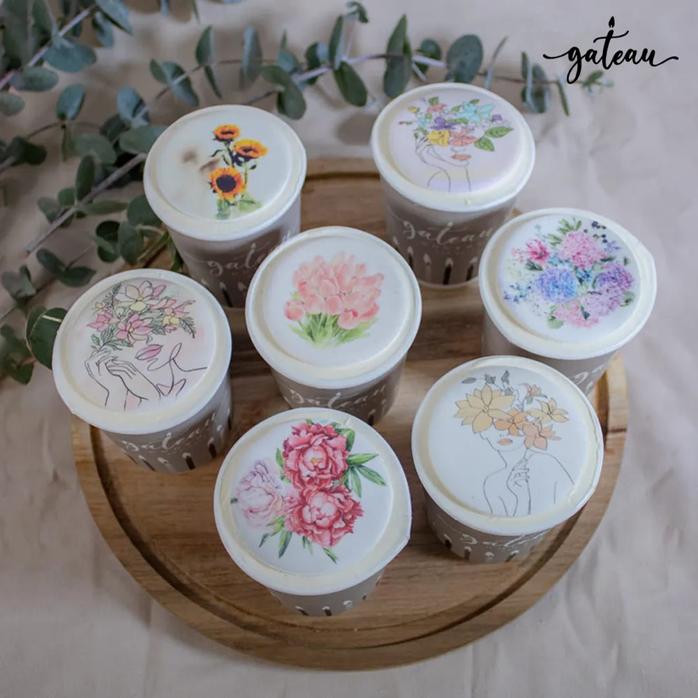 Selection of flower Cup ToGo designs featuring floral illustrations on decorative lids
