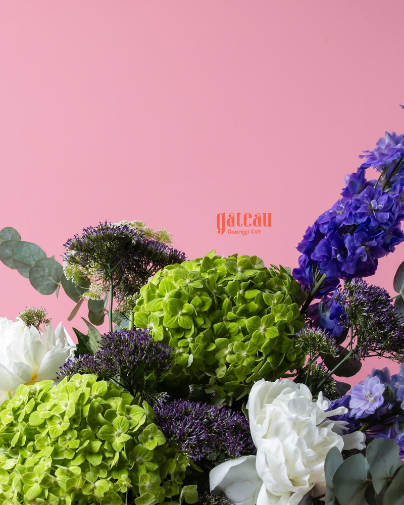 Fresh green and purple flower bouquet by Gateau Gourmet Cafe for fresh floral gifts online