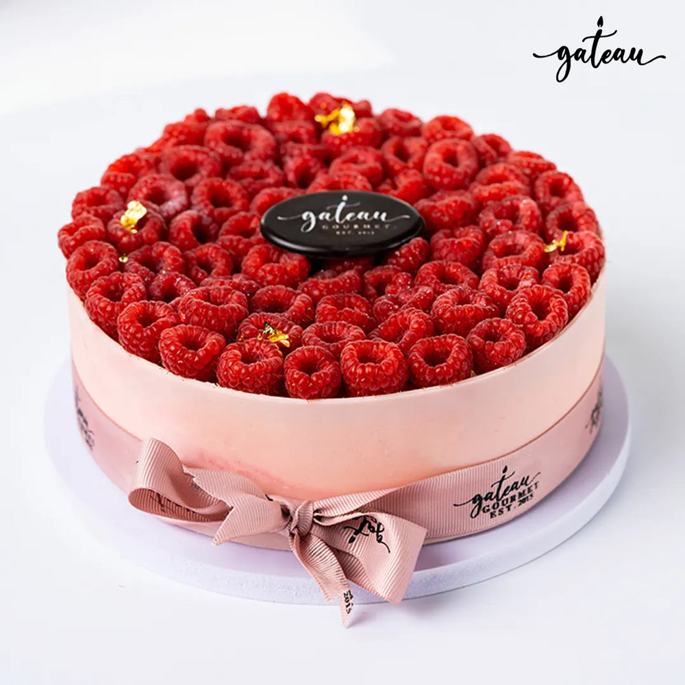 Gateau Gourmet Cafe fresh raspberry cheesecake delivery with fresh raspberries and decorative ribbon