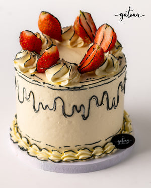 Delicious fresh strawberry cake topped with whipped cream and fresh strawberries from Gateau Gourmet Cafe