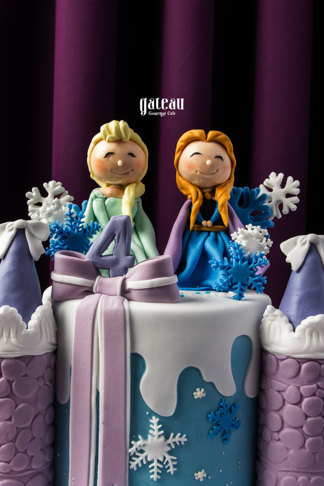Frozen themed birthday cake by Gateau Gourmet Cafe with characters and snowflake decorations