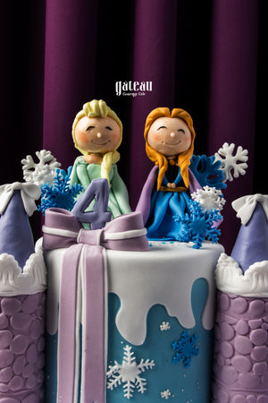Frozen themed birthday cake by Gateau Gourmet Cafe with characters and snowflake decorations