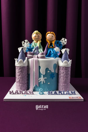 Frozen themed birthday cake by Gateau Gourmet Cafe with castle towers and princess figurines on top