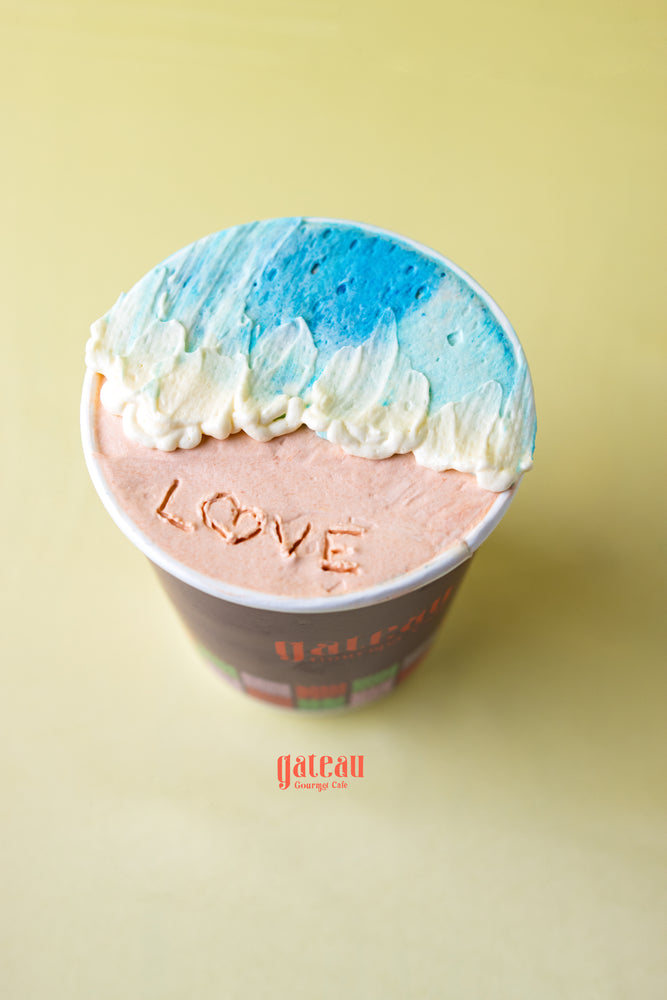Gateau Gourmet Cafe cupcake with love message and blue white frosting, fruit decorated cupcakes for parties