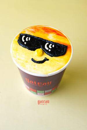 Fruit decorated cupcakes for parties by Gateau Gourmet Cafe featuring a cupcake with sunglasses design