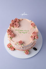 Beautiful cake with a full-bloom-rose-design and elegant pink roses for special celebrations