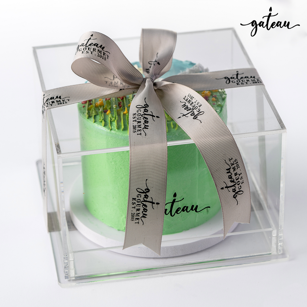 Gateau Gourmet Cafe Garden Flowers Cake in clear packaging with elegant ribbon for special occasions
