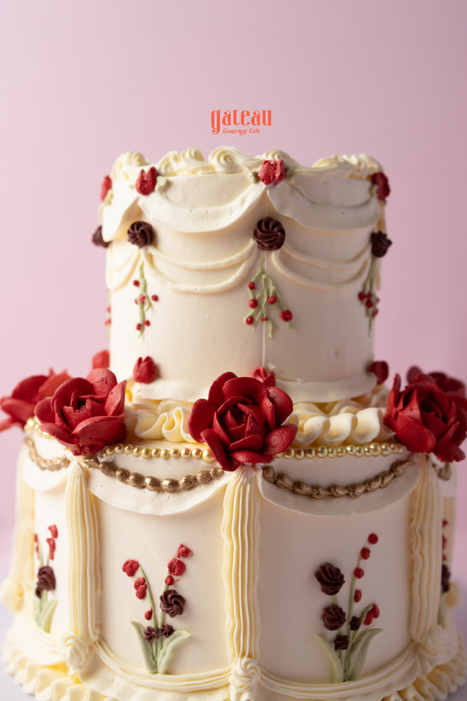 Elegant Garden of Memories cream cake adorned with floral decorations and intricate detailing