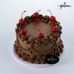 Gateau Gourmet Cafe gourmet chocolate delight cake with rich chocolate frosting and cherries on top