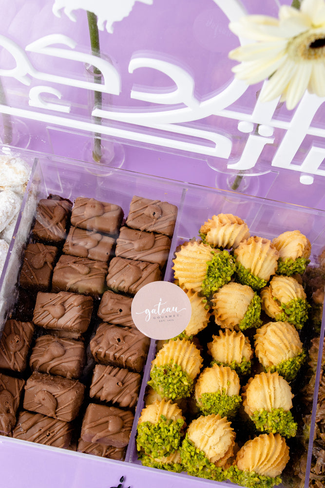 Gateau Gourmet Cafe gourmet dessert box with assorted chocolate and pistachio treats in clear packaging