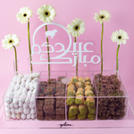 Gateau Gourmet Cafe gourmet dessert box with assorted sweets in clear compartments on pink background