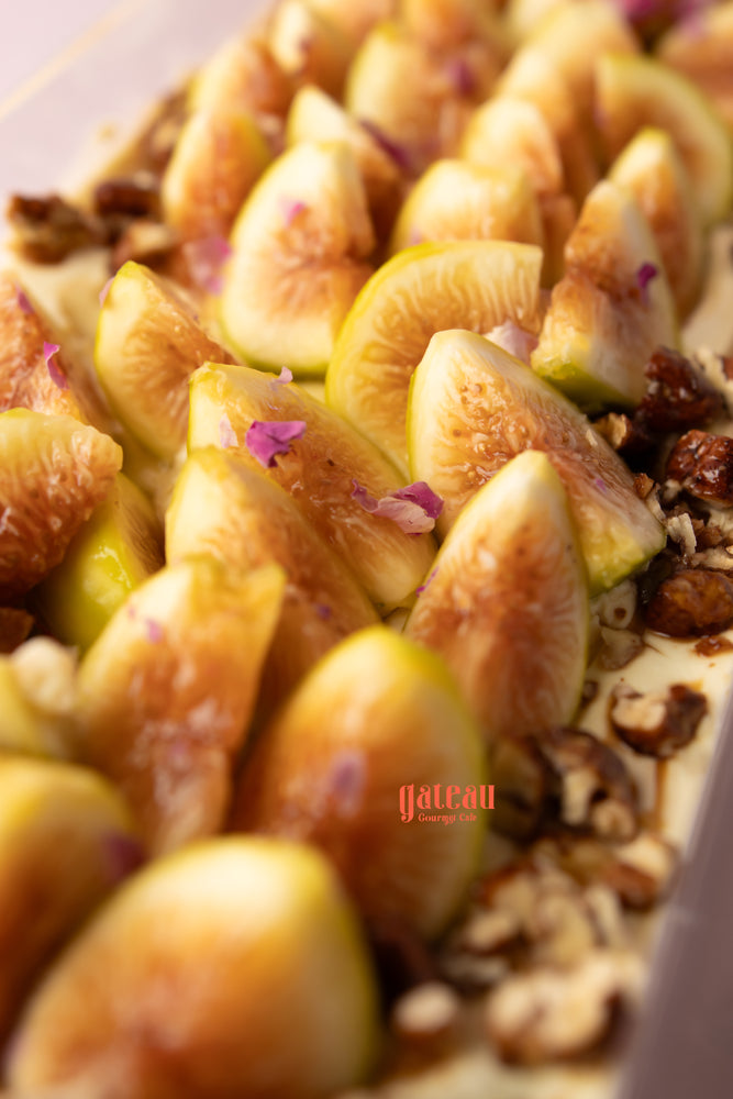 Close-up of gourmet fig cake for special occasions topped with fresh figs and nuts