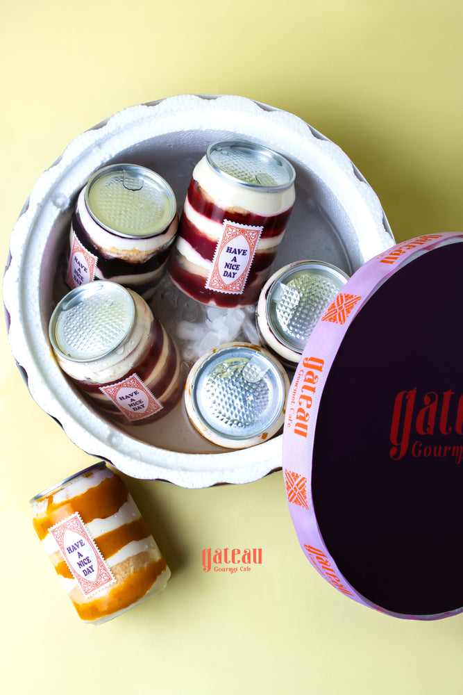 Assorted gourmet summer treats online in a decorative container from Gateau Gourmet Cafe