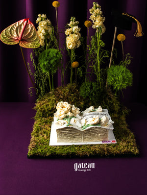 Beautiful Graduate Cake Design with Arrangement featuring floral decorations and a book-shaped cake