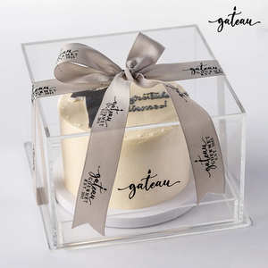 Elegant graduation cake for boys, beautifully presented in a clear box with a decorative ribbon