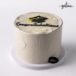 Graduation celebration cake with a mortarboard and 'congratulations' text for festive occasions