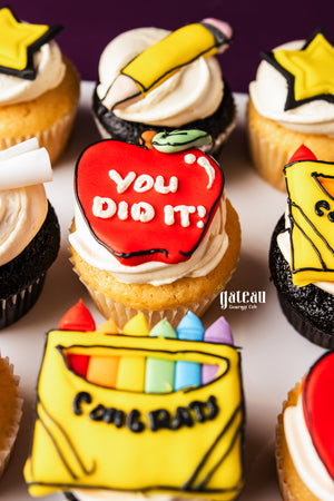 Gateau Gourmet Cafe graduation cupcakes with colorful frosting and congratulatory designs