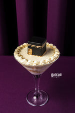 Hajj themed cake goblet from Gateau Gourmet Cafe with cream and black cube decoration in a glass
