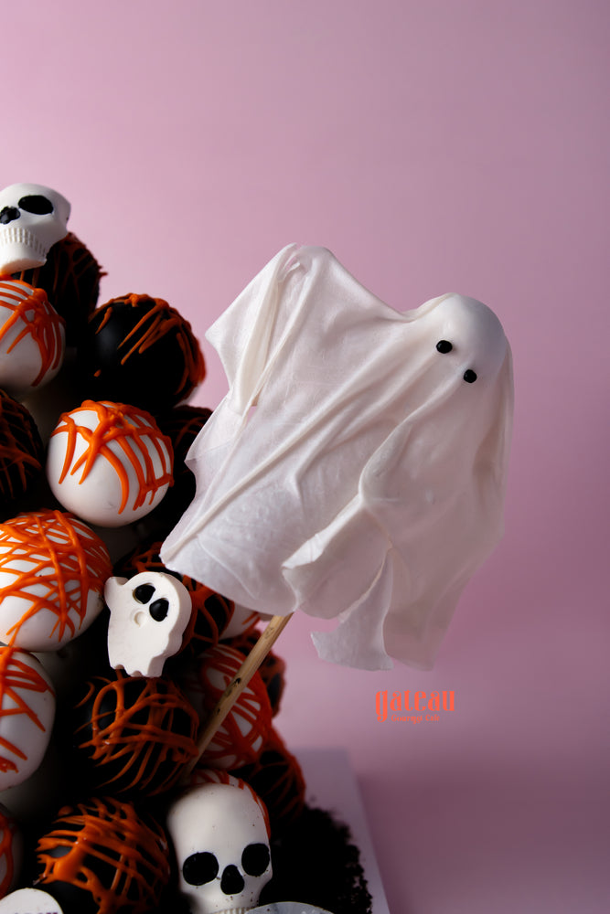 Halloween truffle tower featuring ghost-shaped treats and spooky decorations for festive celebrations