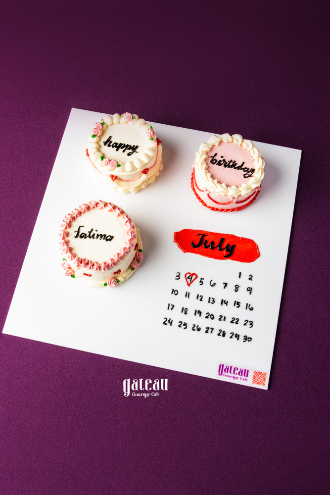 Handcrafted birthday cake for celebration with personalized name and calendar design by Gateau Gourmet Cafe