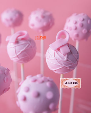 Gateau Gourmet Cafe handcrafted cake pops in pink with decorative icing and ribbon designs