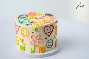 Colorful hippie sticker cake with playful designs and cheerful decorations for celebrations