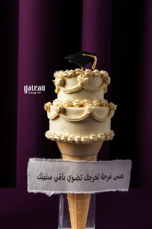 Ice Cream Cone Graduation Cake with decorative frosting and graduation cap for celebration events