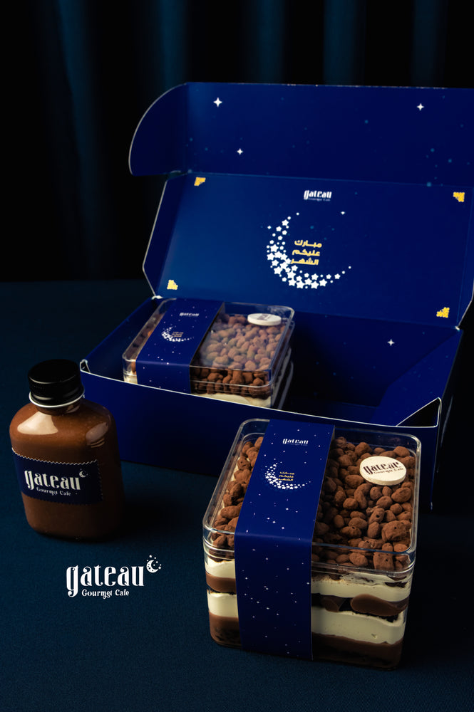 Delicious Krunchoco 2Treats packaged in a blue box from Gateau Gourmet Cafe with a chocolate sauce bottle