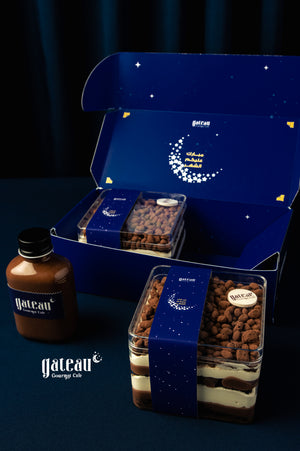 Delicious Krunchoco 2Treats packaged in a blue box from Gateau Gourmet Cafe with a chocolate sauce bottle